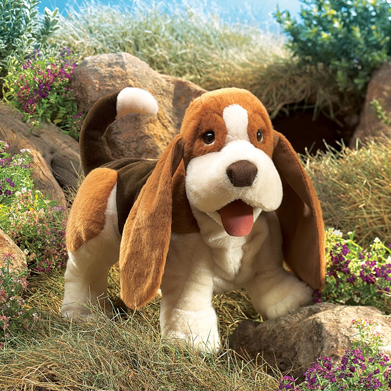 Folkmanis Basset Hound hand puppet in brown and white, standing with open mouth and long floppy ears, front view