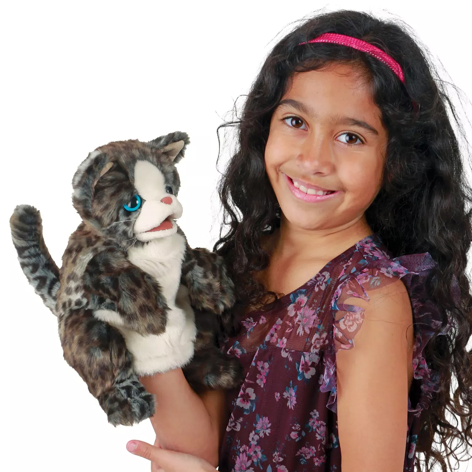 Girl holding a Folkmanis wildcat kitten hand puppet with a grey-brown fur pattern and turquoise eyes up to the camera