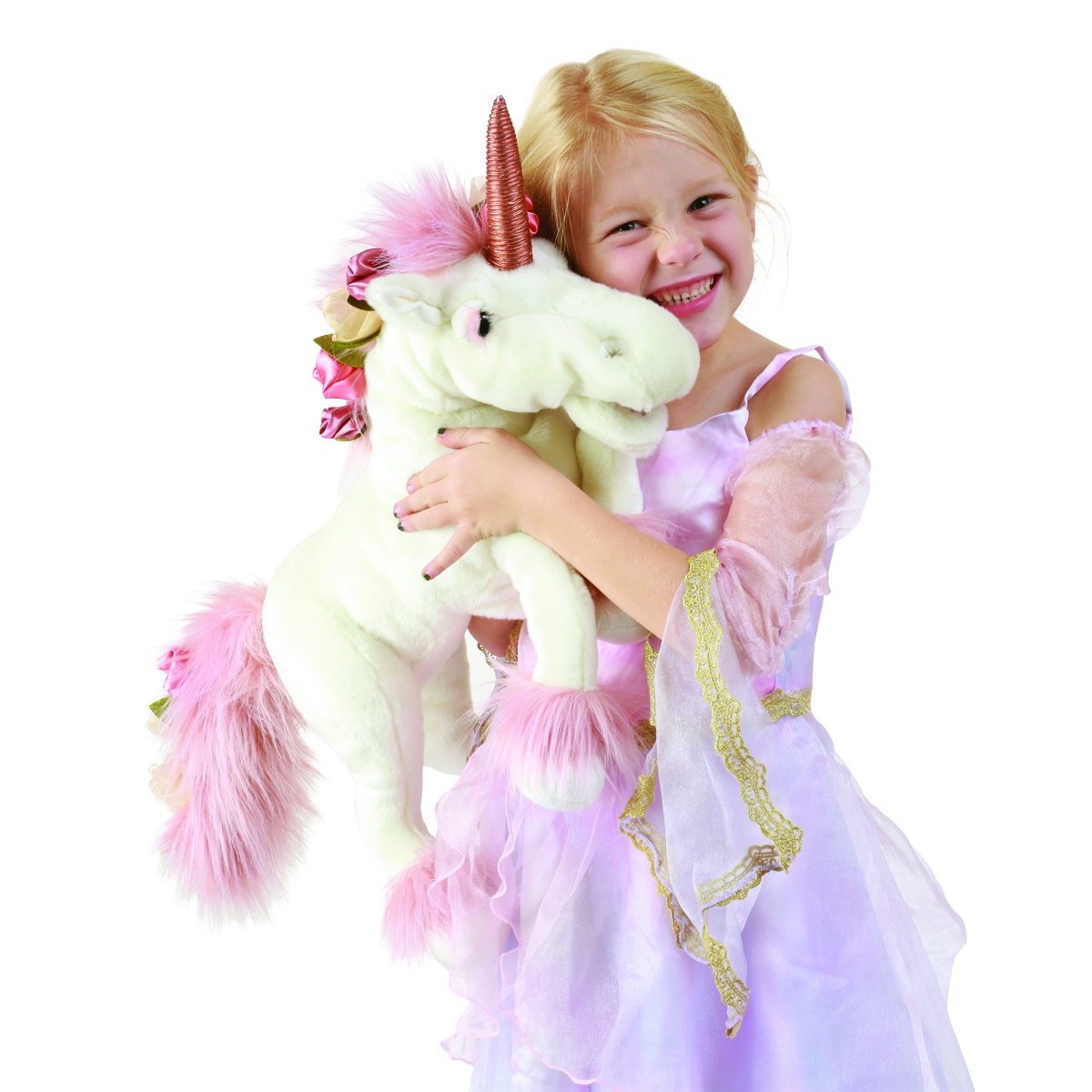 Smiling girl in a princess costume hugging the Folkmanis unicorn hand puppet with white plush and pink mane