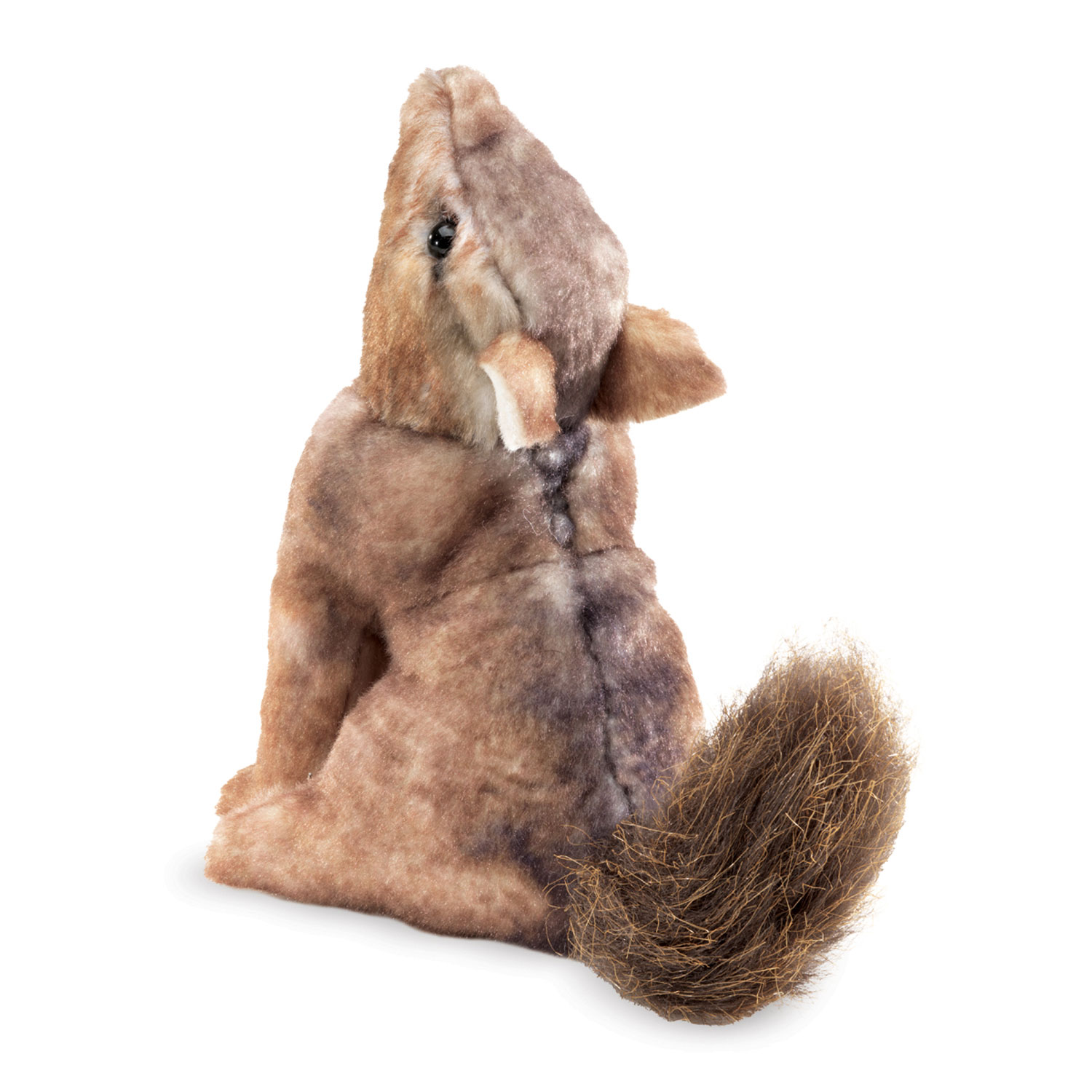 Folkmanis mini coyote finger puppet in brown tones with a bushy tail, head tilted upward, shown at an angle