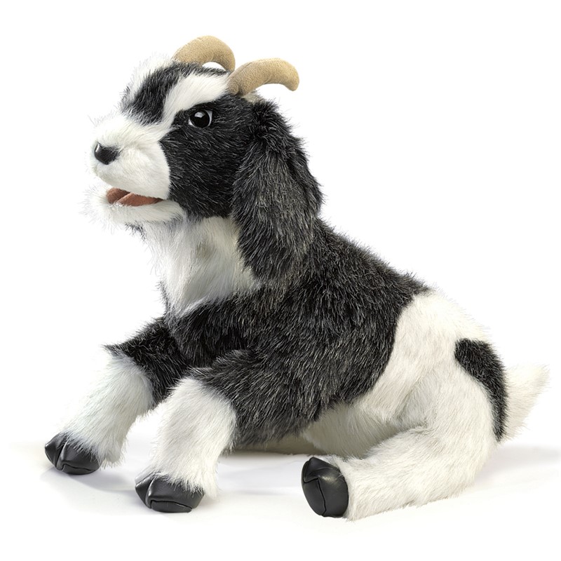 Folkmanis goat hand puppet with black-and-white fur, curved horns and open mouth, shown seated in side view