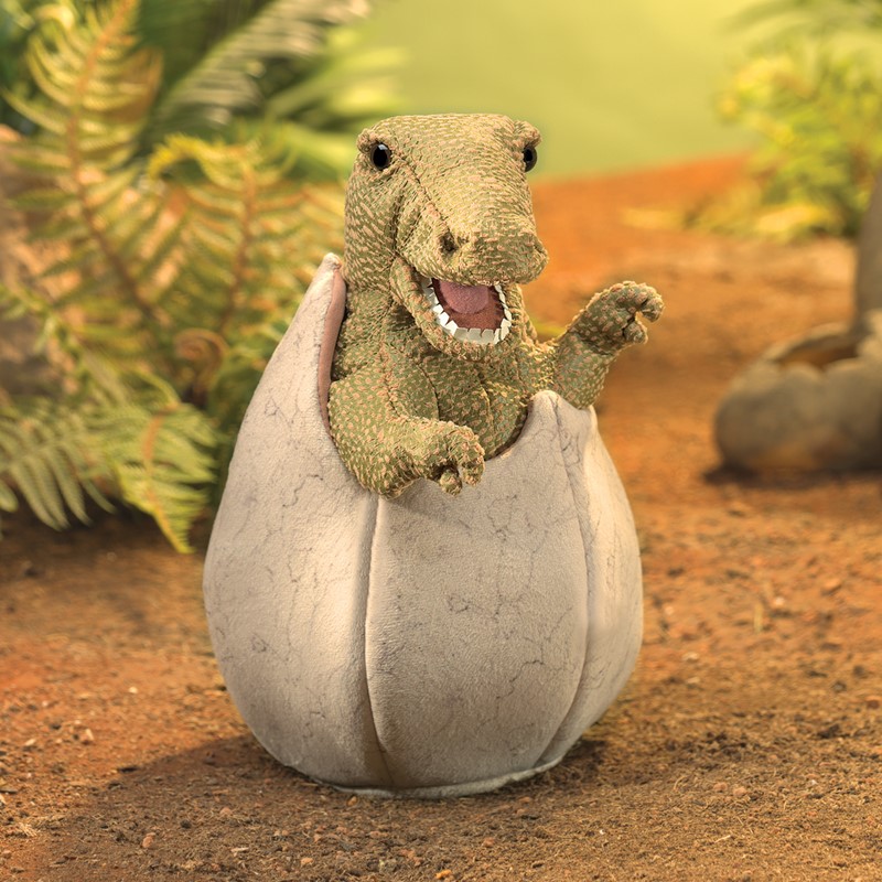 Folkmanis hand puppet dinosaur baby in egg: green dinosaur hatching from a grey-white plush egg, open mouth with teeth, front view