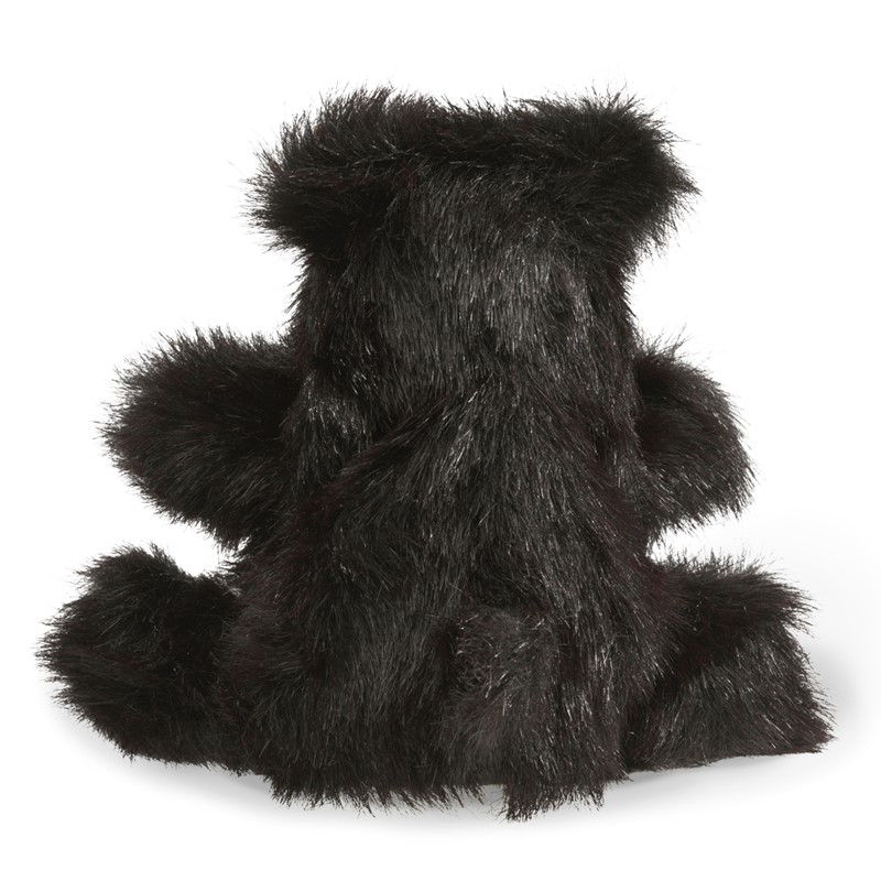 Folkmanis Handpuppe kleiner Schwarzbär mit zottigem schwarzem Fell, sitzend von hinten fotografiert