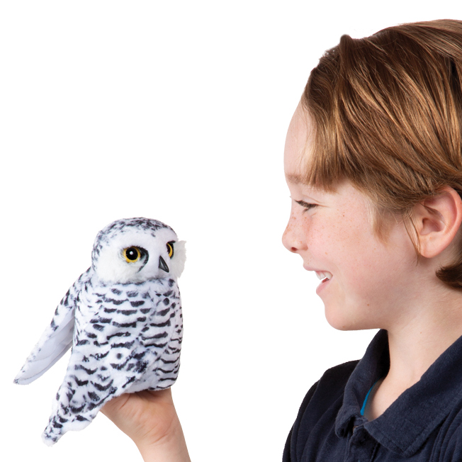 Folkmanis hand puppet small snowy owl with white and black plumage and yellow eyes, worn on a child's hand