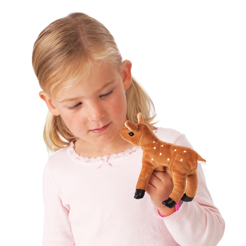 Girl wearing a Folkmanis mini fawn finger puppet in brown with white spots on her finger