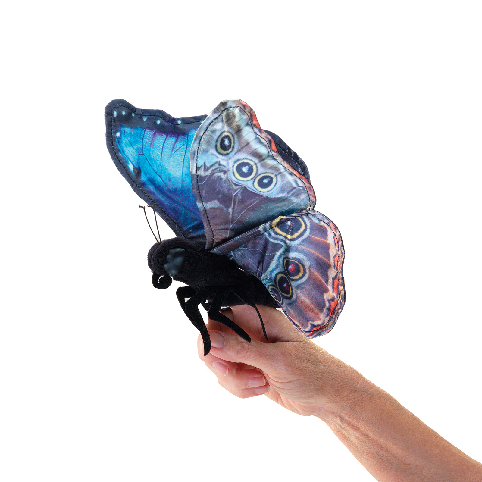 Folkmanis Handpuppe Blauer Morphofalter mit fotorealistischen Flügeln in Blau und Braun, auf einer Hand gehalten, Seitenansicht