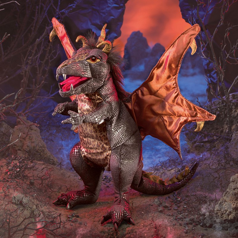 Folkmanis hand puppet black dragon with shiny copper-coloured wings, open mouth and horns against a dramatic volcano backdrop