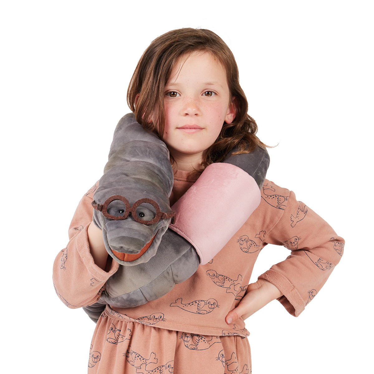 Girl wearing a grey Folkmanis bookworm hand puppet with brown glasses and a pink belly wrapped around her neck