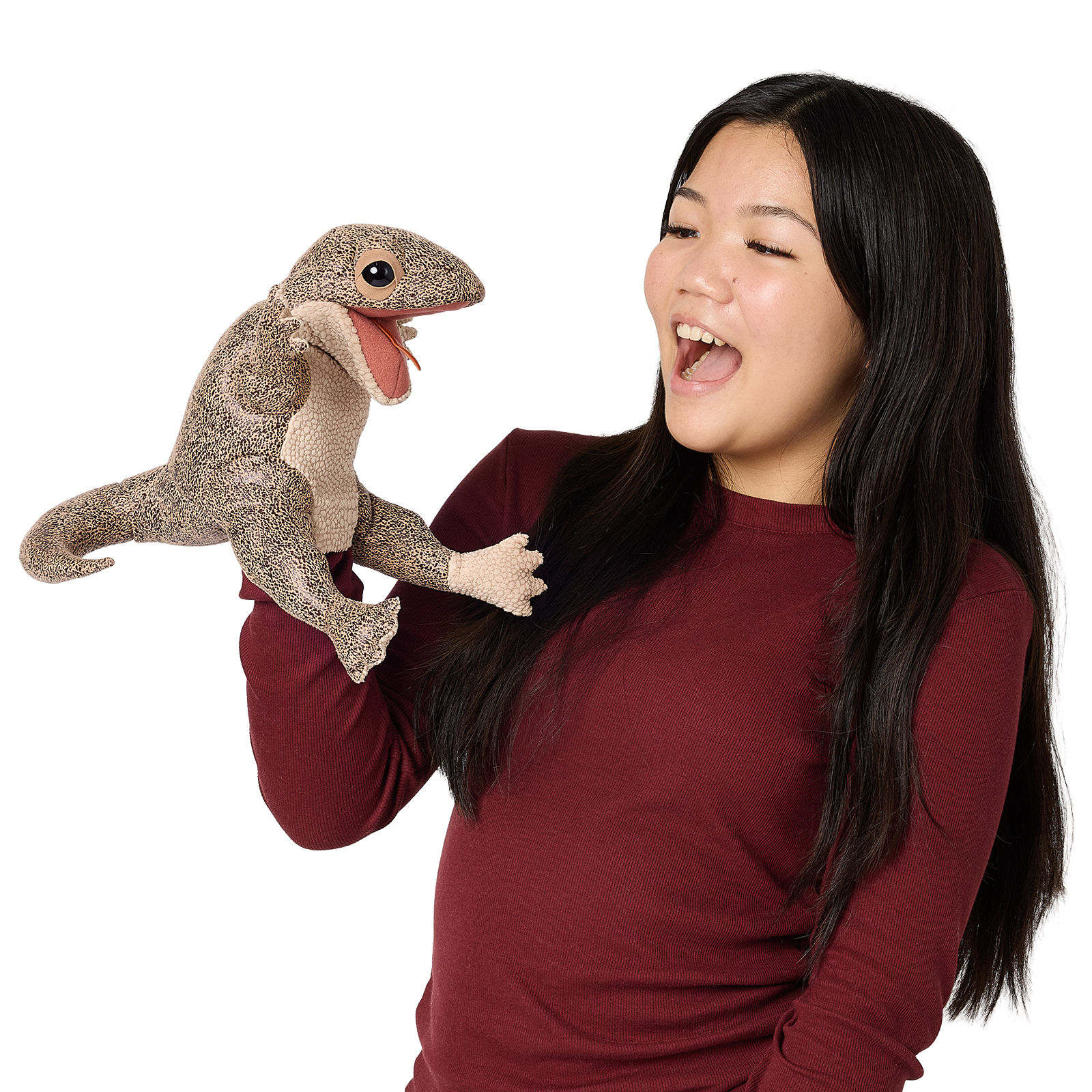 Folkmanis lizard hand puppet in brown tones with a speckled pattern, open mouth and red tongue, worn on the arm of a laughing woman