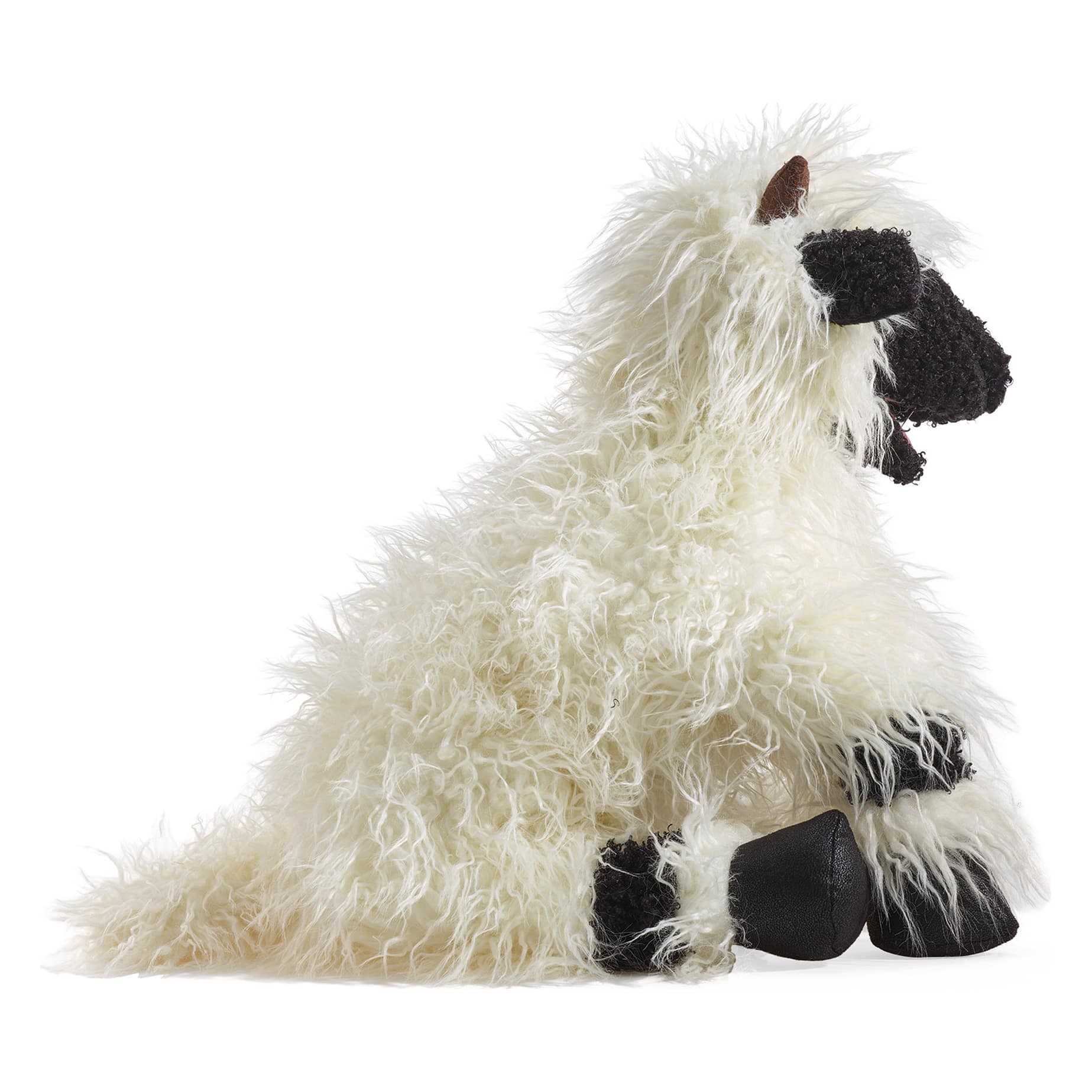 Folkmanis hand puppet Valais Blacknose Sheep with white shaggy fur and black face, shown seated in side view