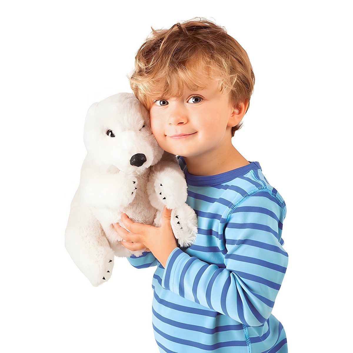 Young boy holding a white Folkmanis polar bear hand puppet against his cheek and smiling at the camera