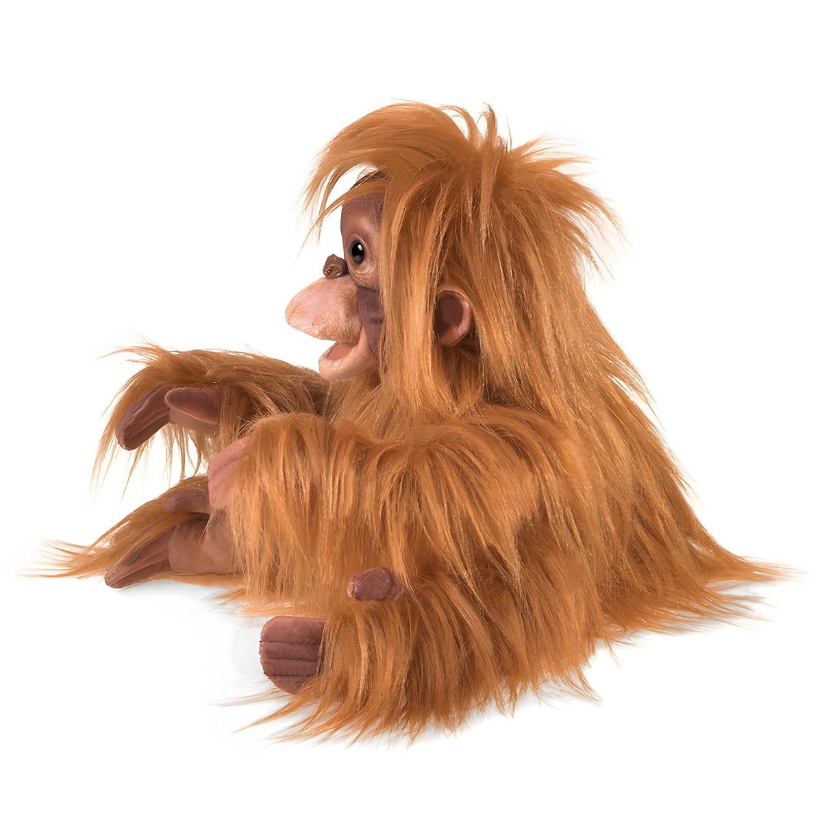 Folkmanis baby orangutan hand puppet with shaggy reddish-brown fur and a detailed face, shown from a side angle