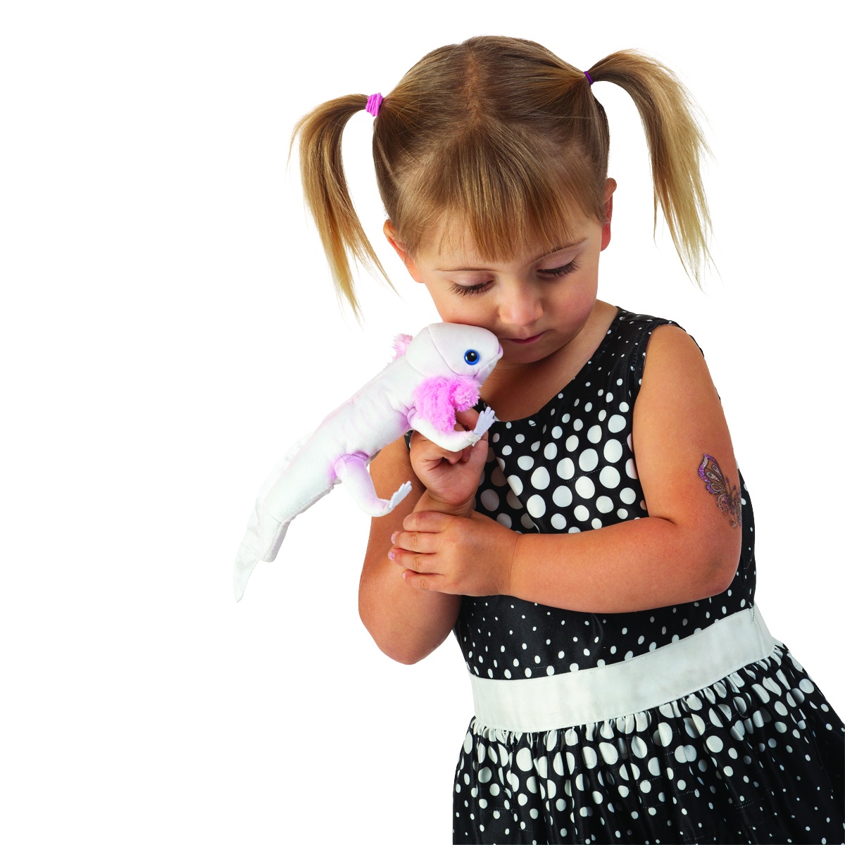 Girl holding a white Folkmanis axolotl finger puppet with pink gills close to her face